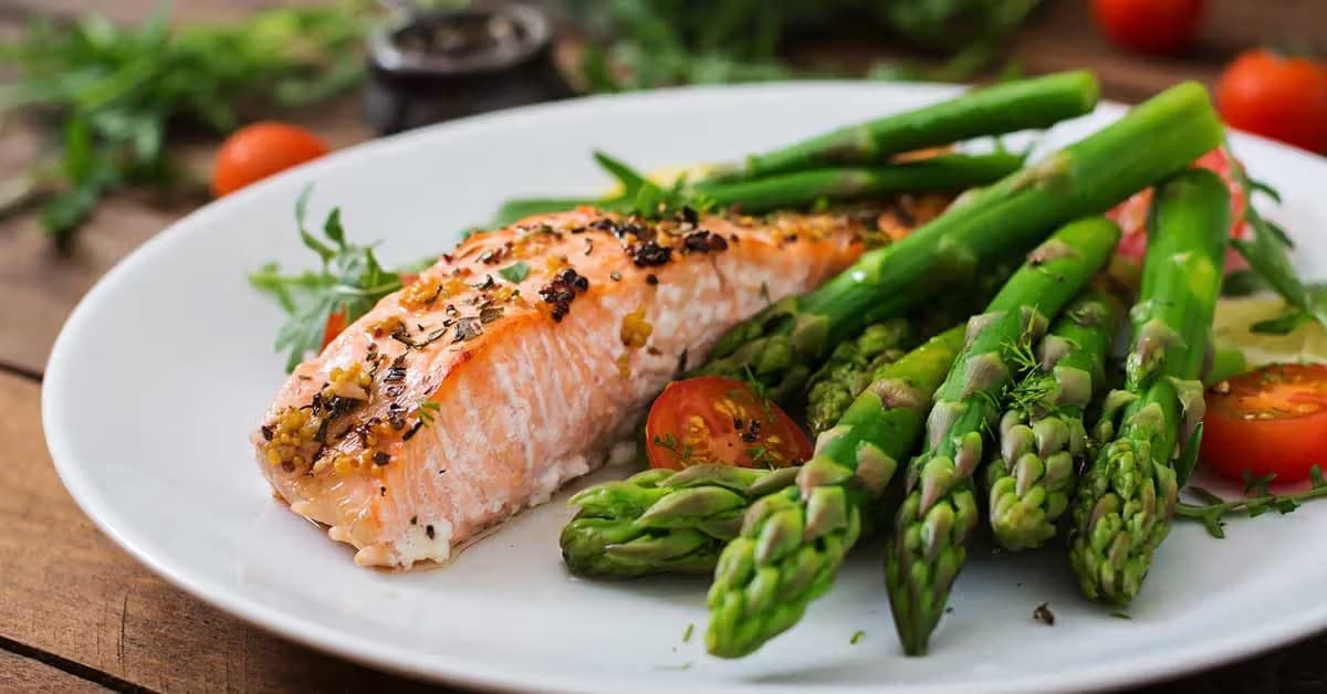 Low-carbohydrate charcuterie-style meal board with nuts, cheese, olives, and vegetables
